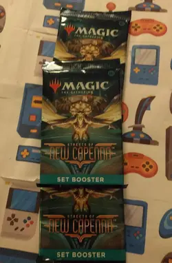 Lot of 3 Magic: The Gathering Streets of New Capenna Set Booster Packs - Image 1