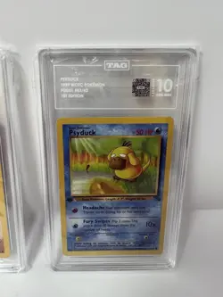 TAG 10 GEM MINT 1999 POKEMON FOSSIL 53 PSYDUCK 1ST EDITION ENGLISH - Image 1