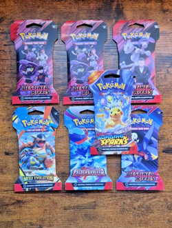 Pokemon TCG Mixed LOT of 7 Sealed Sleeved Booster Packs - Image 1