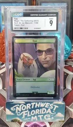 Graded MTG - CGC Mint 9 - Secret Lair: Dr. Ian Malcolm (2023) - Egg Token (Foil) - Image 1