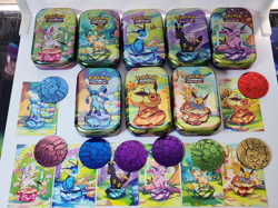 Prismatic Evolutions *EMPTY* Mini Tin Complete Set Of 8 (Tin + Card + Coin) - Image 1