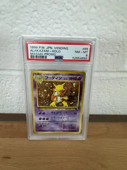 1999 POKEMON JPN VENDING MASAKI PROMO #65 ALAKAZAM-HOLO PSA 8 - Image 1