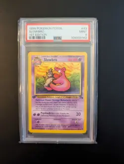 1999 POKEMON FOSSIL 1ST EDITION #43 SLOWBRO PSA 9 - Image 1