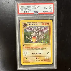 1999 POKEMON FOSSIL 1ST ED AERODACTYL-HOLO PSA 8 #1/62 POKEMON TCG CARD STOCK - Image 1