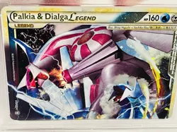 2010 Pokemon Heartgold and Soulsilver Triumphant Dialga/Palkia Legend PSA 7 - Image 1