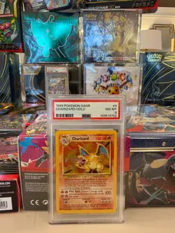1999 POKEMON BASE SET UNLIMITED #4 CHARIZARD-HOLO PSA 8 - Image 1