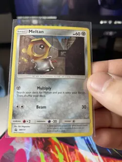 Meltan SM177 Sun & Moon Cosmo Holo Ultra Rare Black Star Promo Pokemon Card NM - Image 1