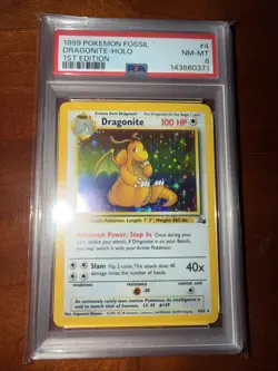 1999 Pokemon Fossil - Dragonite Holo 1st Edition PSA 8 - Image 1
