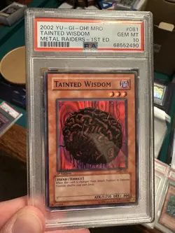 2002 Yu-Gi-Oh! Tainted Wisdom Metal Raiders MRD 1st Edition Common PSA 10 - Image 1