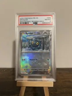 2025 Pokemon TCG Prismatic Evolutions 066 Bronzor Master Ball Reverse Holo PSA8 - Image 1