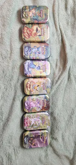 Pokemon TCG Prismatic Evolutions Full Set of 8 Sealed Mini Tins - Image 1