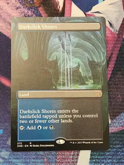 MTG ONE - Darkslick Shores Borderless NM - Image 1