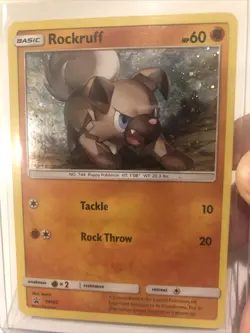 Pokemon TCG Rockruff SM Black Star Promo SM06 Holo Promo Lightly Played - Image 1