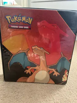 Pokemon card binder with several pages of Pokemon cards - Image 1
