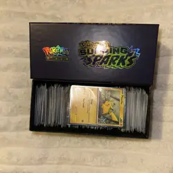 Pokemon Surging Sparks ETB Box Filled with Loose Cards + Pikachu Holiday Card - Image 1