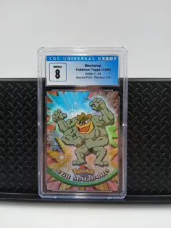 Pokemon Machamp #68 from Topps Series 1 First Print in a CGC 8 - Image 1