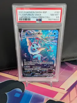 2021 POKEMON SWSH BSP FA/VAPOREON VMAX VAPOREON VMAX PREM.COLL. PSA 8.5 SWSH182 - Image 1