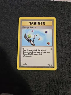 Energy Search 1st Edition 59/62 Fossil Common Pokemon Vintage Card WOTC NM 1999 - Image 1