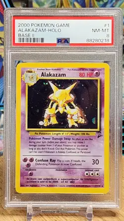 Pokemon TCG PSA 8 Alakazam 001/130 Base Set 2 Holo - Image 1