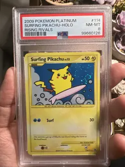 Rising Rivals Surfing Pikachu Holo 2009 Pokemon Platinum #114/111 PSA 8 Swirl - Image 1