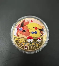 POKEMON GOLD PLATED COLLECTIBLE COIN EEVEE PIKACHU - Image 1