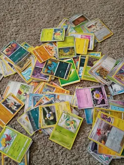 MYSTERY ASSORTMENT OF POKEMON CARDS: 1 SLEVED HOLO INCLUDED!! KONRADE KARDS - Image 2