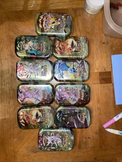 10 Pokemon TCG Scarlet & Violet Prismatic Evolutions Mini Tins - Image 1