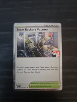 Team Rocket's Factory (Cosmos Holo) Pokemon Prize Pack Series 8 DRI 173/182 NM - Image 1