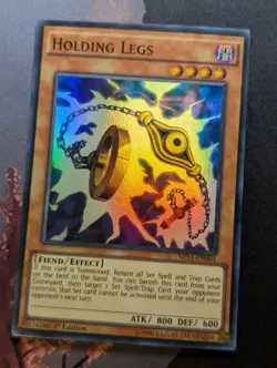Yugioh Holding Legs - MIL1-EN004 - Super Rare - 1st Edition - Image 1