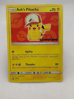 Ash's Pikachu SM109 Black Star Promo 2017 Pokemon Card Plus 100+ Random Cards - Image 1