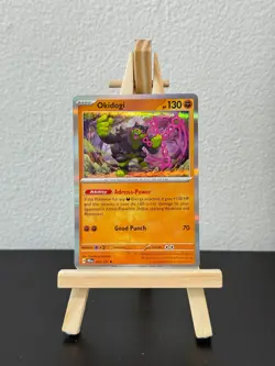 Okidogi #057/131 Holo Rare - Prismatic Evolutions Pokemon TCG Card NM/M - Image 1