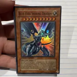 Konami Blue-Eyes Shining Dragon MOV-EN001 Super Rare Holo Effect Limited Edition - Image 1