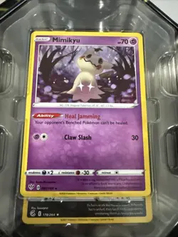 Opened Pokemon TCG: Mighty Mysterious Mimikyu Tin - Image 2