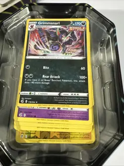 Opened Pokemon TCG: Mighty Mysterious Mimikyu Tin - Image 4