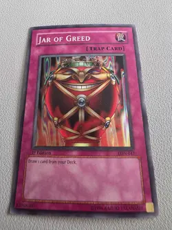 Yugioh Jar of Greed LON-047 Super Rare 1st Edition - Image 1