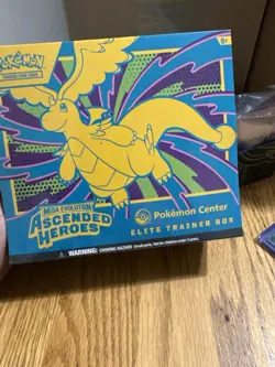 Pokemon TCG Ascended Heroes ETB Pokemon Center Exclusive SEALED-IN HAND - Image 1