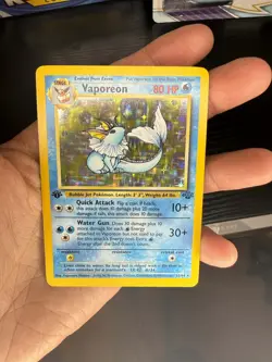 1999 POKEMON VAPOREON 1ST EDITION JUNGLE 12/64 HOLO RARE NM - Image 1