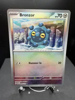 Pokemon TCG SV Prismatic Evolutions Bronzor 066/131 Master Ball Reverse Holo NM - Image 1