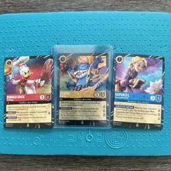Disney LORCANA Walt Disney World Epcot Stitch, Donald Duck and Rapunzel Cards - Image 1