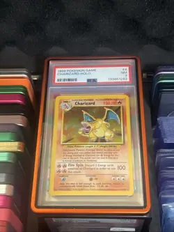 Base Set Charizard Holo PSA 7 004/102 with Mettalic Guard Pokemon Card NEW CERT - Image 1