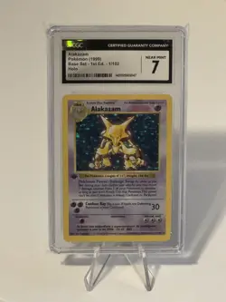 1999 Pokemon Alakazam 1/102 1st Edition Shadowless Base Set Holo CGC 7 Near Mint - Image 1