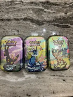 Pokemon TCG: Scarlet & Violet Prismatic Evolutions Mini Tins- C25 (Set of 3) NEW - Image 1