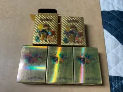 Five packs of gold foil Pokemon cards...four are sealed - Image 1