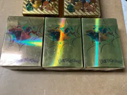 Five packs of gold foil Pokemon cards...four are sealed - Image 2
