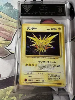 Get Graded 8 1997 POKEMON JAPANESE FOSSIL #145 ZAPDOS-HOLO - Image 1