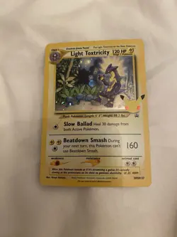 Light Toxtricity Pokemon Celebrations Holo Card SWSH137 Promo - Image 1