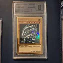 YuGiOh Blue-Eyes White Dragon + Dark Magician girl graded 8 and 6 1st editions - Image 2