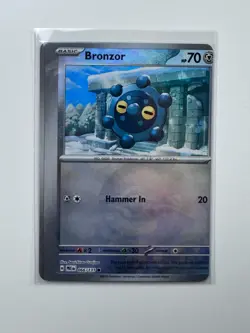 Pokemon Prismatic Evolutions Bronzor Poke Ball Holo Miscut Error Factory Cut NM - Image 1