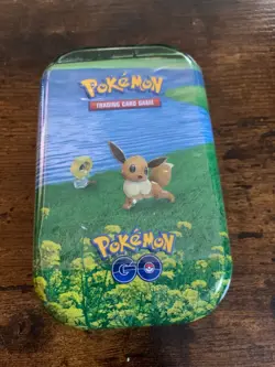 Eevee Pokemon GO Mini Tin *2 Booster Packs, 1 Coin, 1 Art Card Pokemon TCG *New* - Image 1