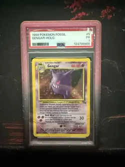 1999 POKEMON FOSSIL #5 GENGAR-HOLO PSA 1 LOW POP GUARD INCLUDED - Image 1